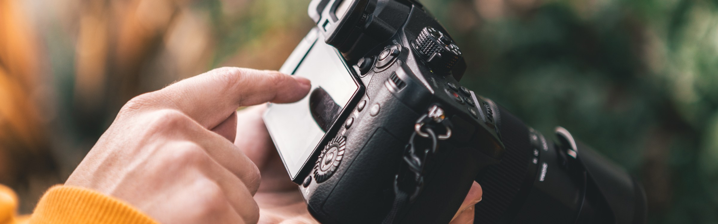 man operating 35 mm camera
